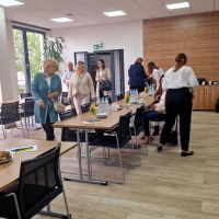 Gromadzący się na sali konferencyjnej zaproszeni Klienci Banku